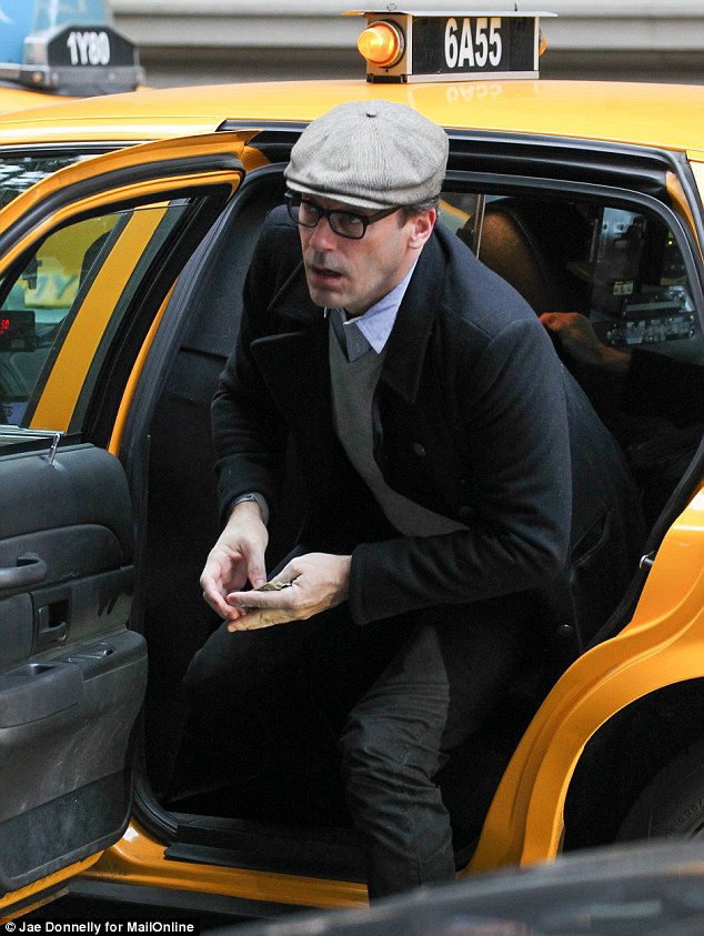 Jon Hamm arrived in a taxi with his partner Jennifer Westfeldt outside the New York apartment