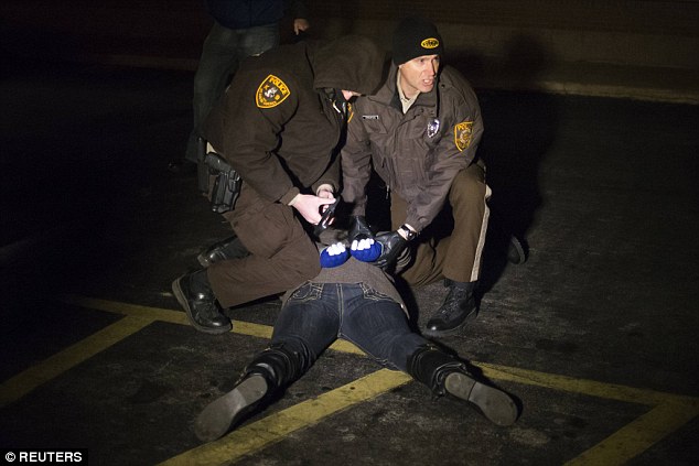 High security: Police have been armed with grenades and military vans to prepare for the grand jury verdict