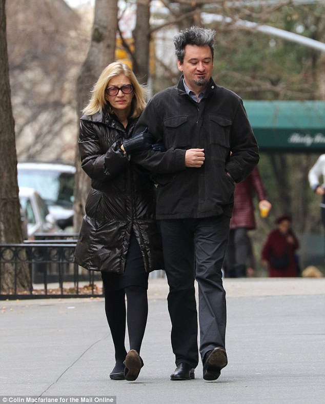 A grieving Diane Sawyer and her stepson Max Nichols walk to Sunday chuch at Utitarian Curch of All Souls in New York City