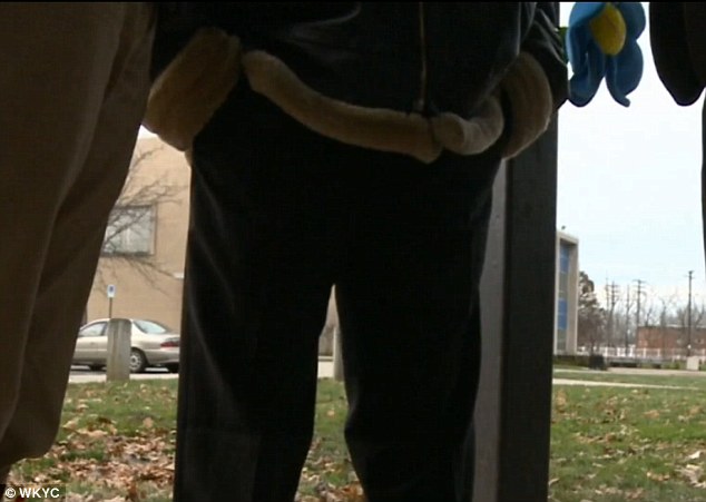 Distraught: 'I'm trying not to cry about the situation but the situation hurts,' he told WKYC.com. Above, Mr Henderson - who did not wish for his face to be revealed - speaks to reporters following his son's death