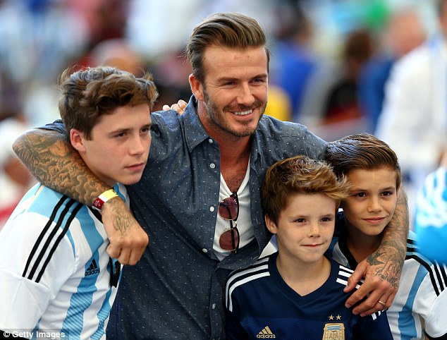 Former England captain David Beckham and sons Brooklyn (left), Cruz (centre) and Romeo (right)