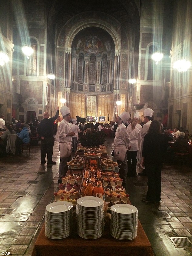 Fancy Thanksgiving: Some of the culinary staff stand near the dessert table during a holiday dinner served at St. Bartholomewís Church