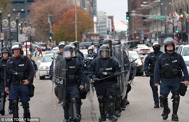 Prepared: Police in riot gear respond to Michael Brown shooting protesters outside of the Edward Jones Dome during the NFL game between the Oakland Raiders and St. Louis Rams