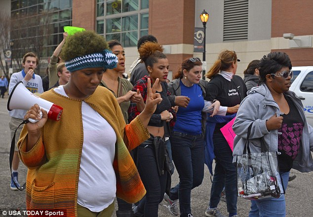 Activism: Across the street from the stadium, about 75 protesters gathered in the second half as about 30 police wearing riot gear watched from a safe distance