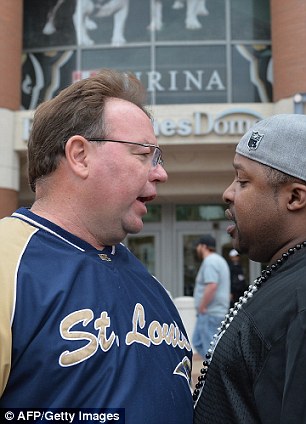 Confrontation: Tensions were high between Rams and Raiders fans on Sunday before the game in St. Louis