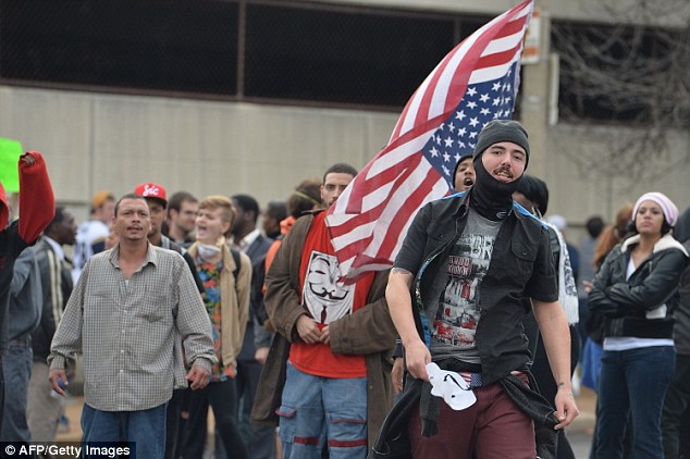 Grievances: Demonstrators marched through the streets of St. Louis that eventually led to clashes with police officers and fans of an American Football game between the St. Louis Rams and Oakland Raiders