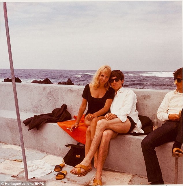 Three's company: Paul and Kirchherr cuddle-up as George clowns-about with a sticker on his nose