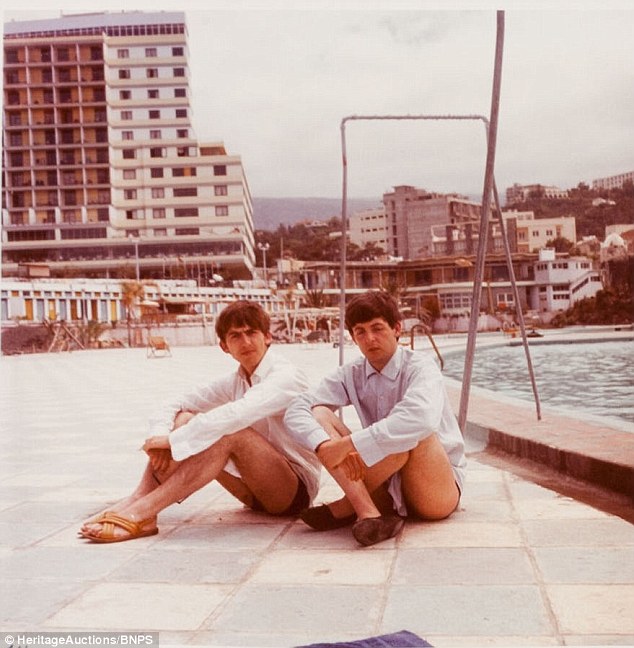 Back to back: Paul and Ringo take a seat and pose for a picture beside the pool in Tenerife