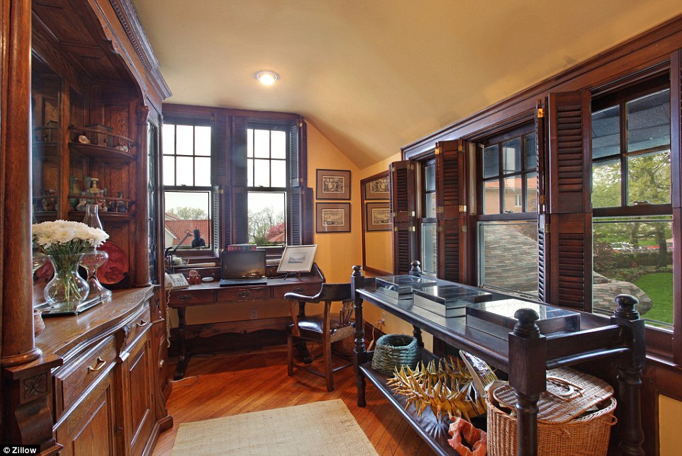 Old World charm: There is wood paneling throughout the house, including in this cozy office space