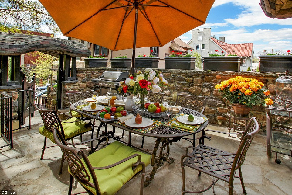 Spectacular setting: Outside, the new tenants of the Gingerbread House will be able enjoy eating al fresco in the backyard