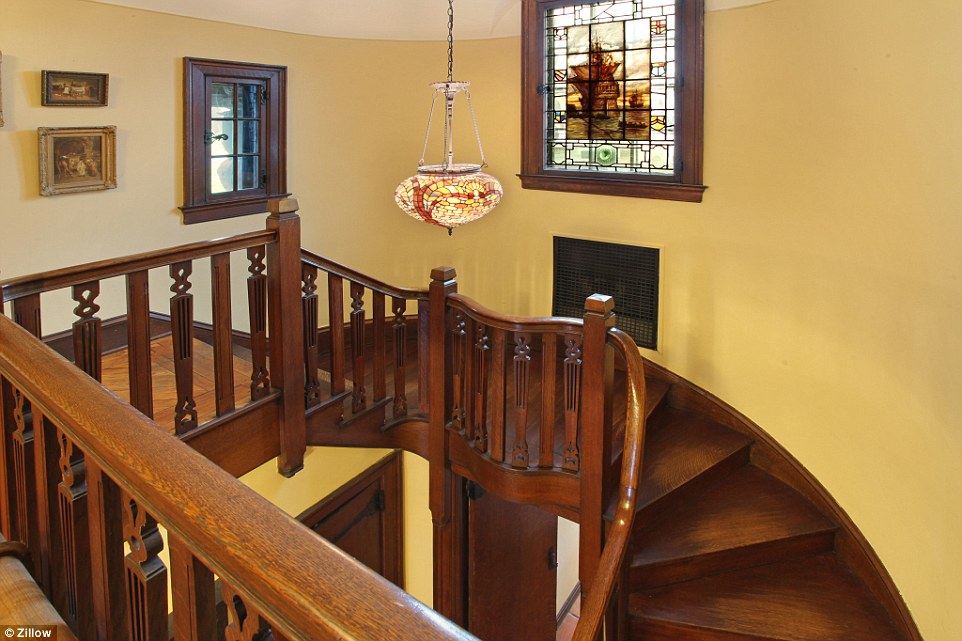 Attention to detail: The house comes with this breathtaking wooden staircase, stained-glass windows and chandeliers