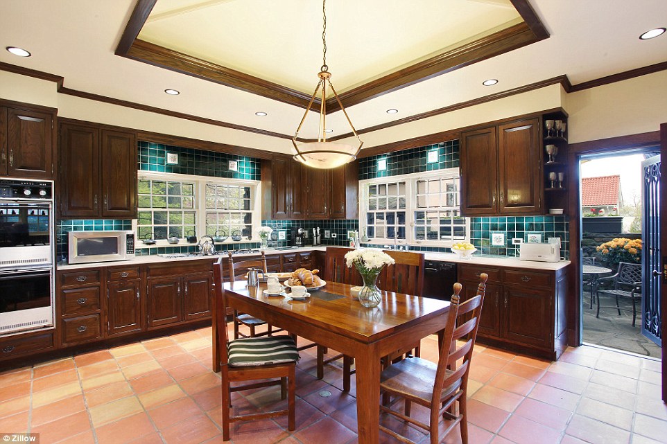 Cooking up a storm: The high-end dwelling boasts a gourmet kitchen with modern appliances and fine cabinetry