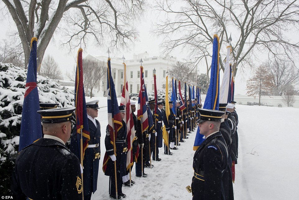 Cold day for Mexico: A US honor guard waits in the snow before the arrival of President of Mexico Enrique Pena Nieto, at a snowy White House on Tuesday