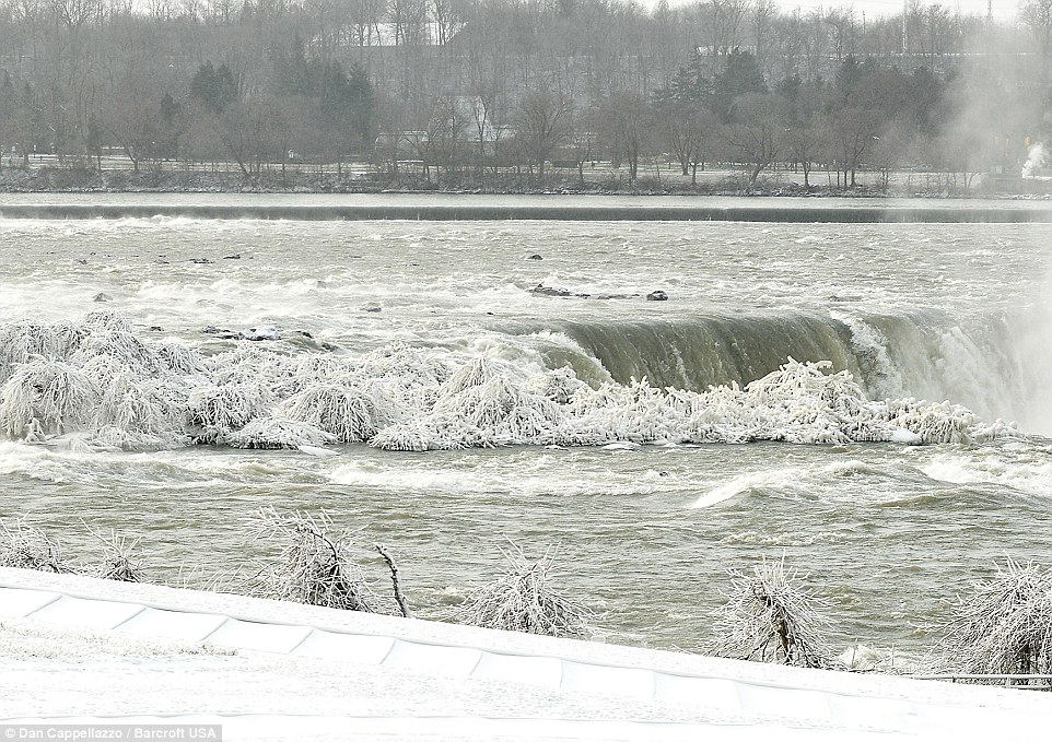 Blast: Icy temperatures of up to minus eight degrees Celsius have turned the iconic Niagara Falls into a glistening crystalline wonderland after a cold snap swept across the north eastern United States plunging temperatures and transforming the landscape
