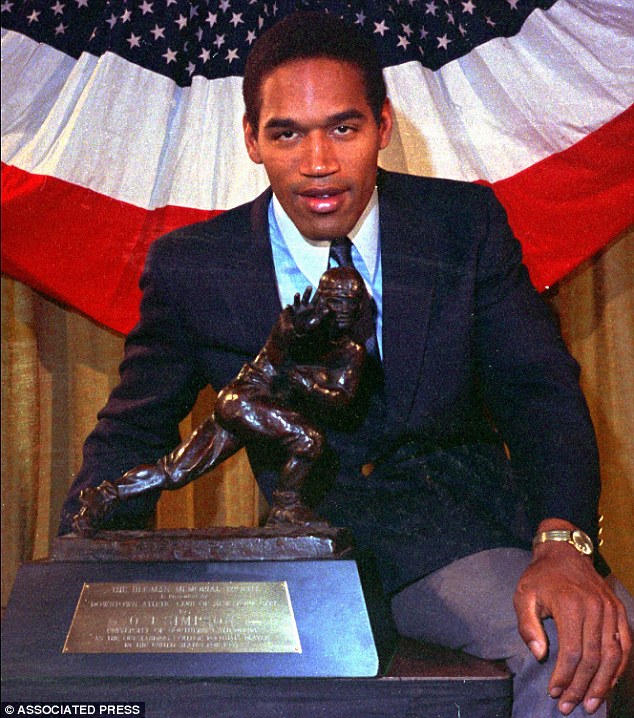 Simpson poses with his Heisman Trophy at New York's Downtown Athletic Club in this 1968 file photo