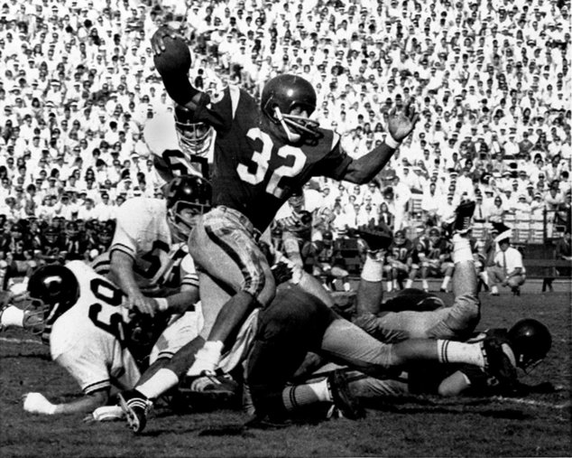 Southern California's O.J. Simpson tries to break a California tackle as he picks up five yards in Los Angeles Memorial Coliseum in this November 1968 file photo
