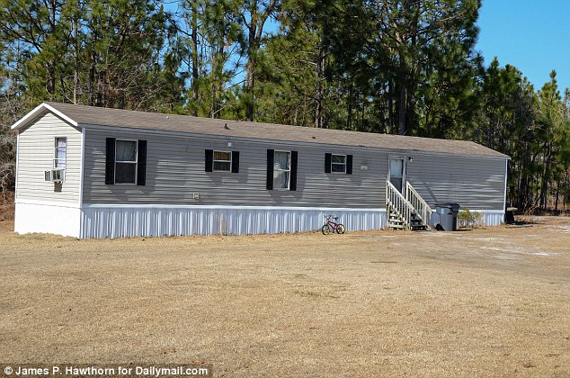 Holmes has been living in the pictured trailer with multiple family members. She hopes to buy a new house for her and her kids with the earnings, but she doesn't know if she'll settle in North Carolina