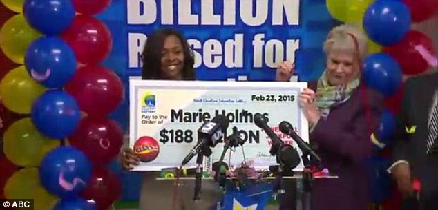 Holmes announced her winnings to a local news station earlier this month. But the handing over of the large check makes her winnings official