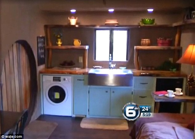 Inside the hobbit house there is a full kitchen with farmer-style sink, washer, dryer and lots of storage. The house also has a water heater, central heating and air conditioning