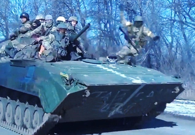 Don't slip: While speeding along the road the tank swerved slightly to the right and a soldier toppled off