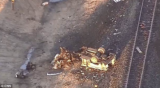 The driver of the tractor-trailer which was on the tracks reportedly ran off but was caught, authorities said