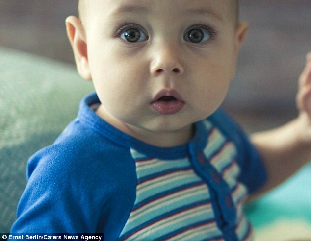 Mr Berlin, 33, asked 50 artists to paint a picture of his son Jacob (above) and was pleased that 23 responded