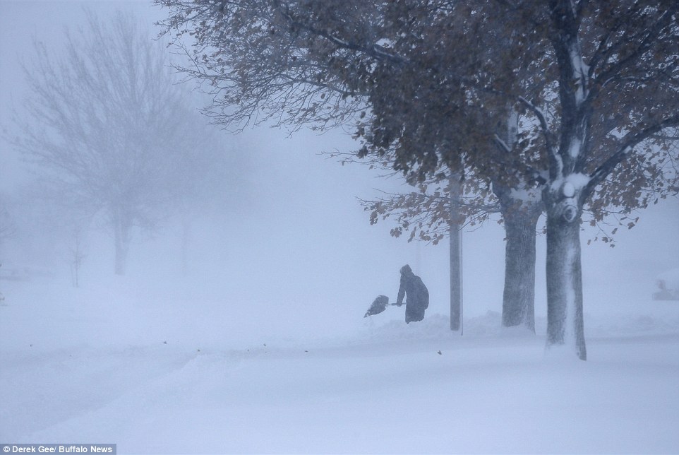 High winds mixed with the heavy snowfall to cause-near whiteout conditions in much of Buffalo