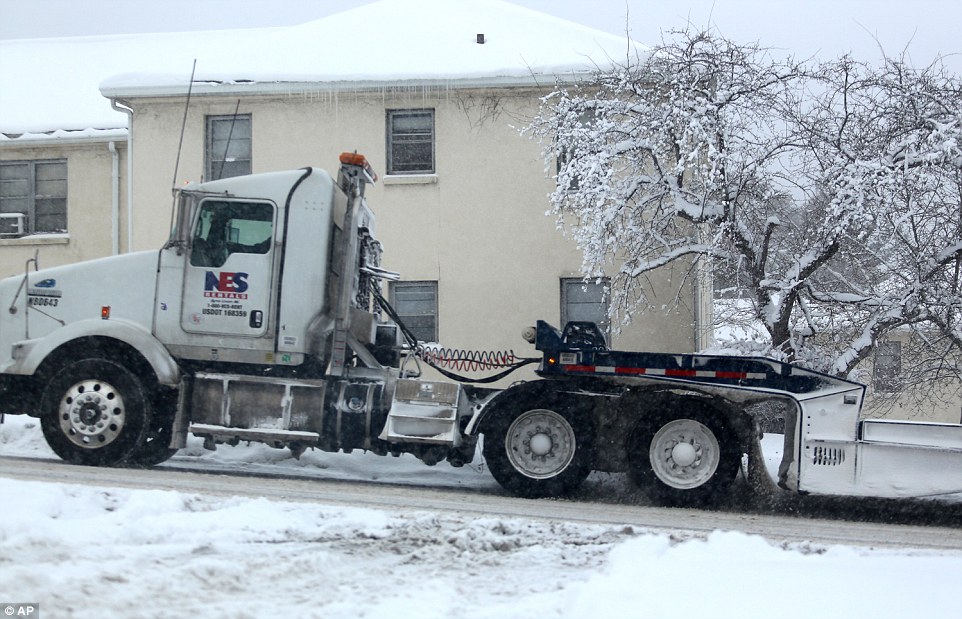 Roll on: A semi tries its best to heave itself up a steep street in Kalamazoo, Michigan