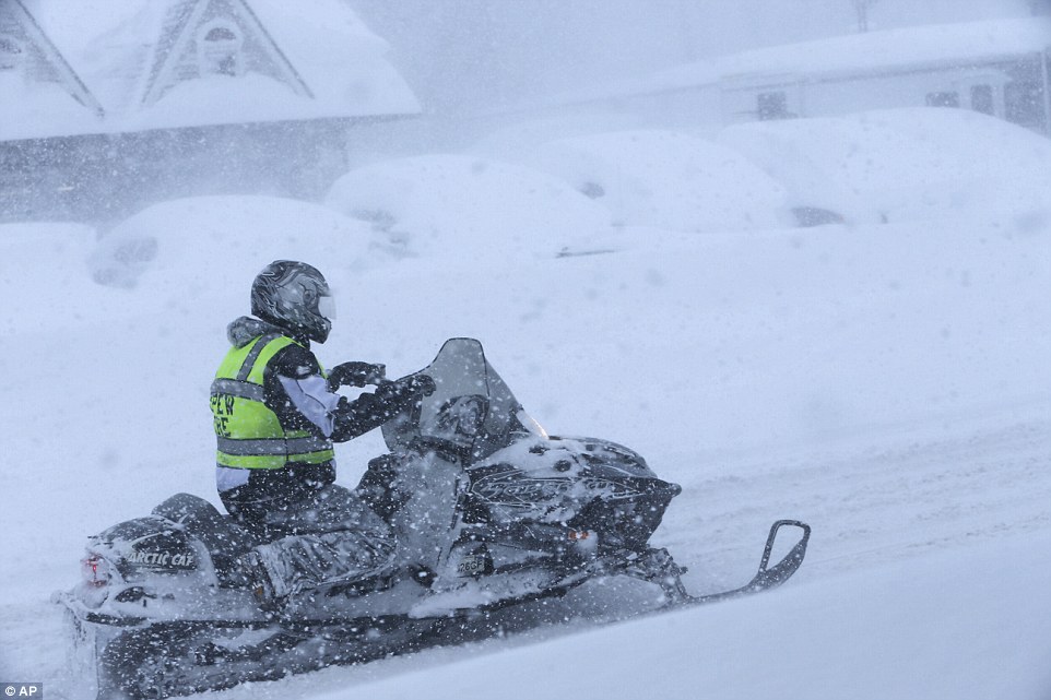 Alternative transportation: A firefighter left his truck behind and got on a snowmobile in Depew, New York, on Tuesday