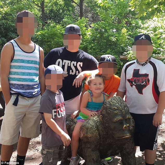 The couple's children pose for a family photo. State police spokesman Michael Reichardt said the couple had planned the vacation with children they had together and children from past relationships