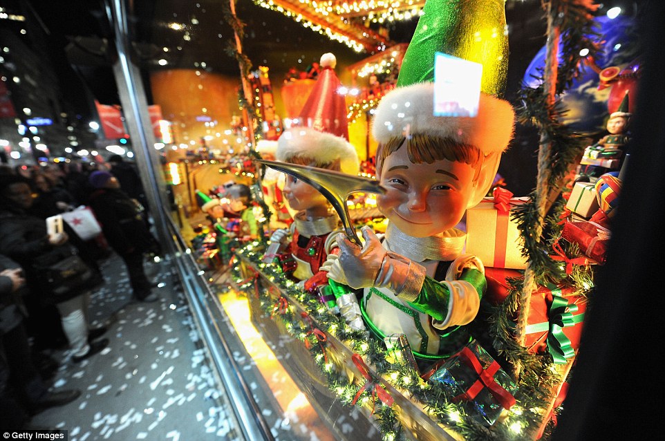 With the classic film "It's a Wonderful Life" playing on an a gigantic screen in the pedestrian area in front of Macy's Herald Square's Broadway entrance, the retailer unveiled its holiday window 