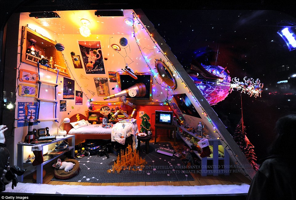 Wild imagination: Christmas on a nother planet as dreamed up by the creative team at Macy's. Santa's sleigh can be seen flying off to the next planet to deliver presents! 