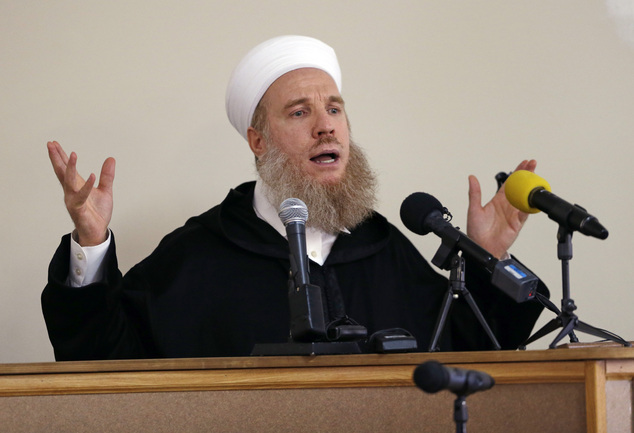 Powerful eulogy: Sheikh Muhammad Al-Yaquobi, famed Muslim scholar and former preacher of the Grand Umayyad Mosque of Damascus, leads funeral prayers for Peter Kassig, whom he praised as a hero