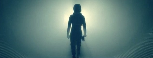 Preparing: The commercial for EMC Enterprise shows a suited up driver ready to participate in the record breaking stunt in which a tractor trailer jumps about 83 feet over a Formula 1 car