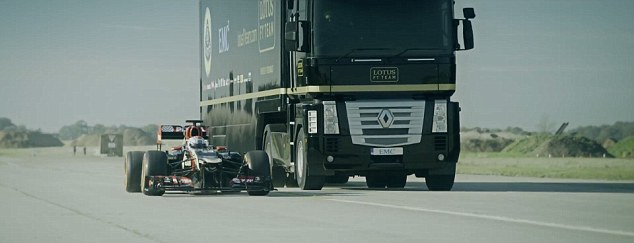 Before the jump: The Formula 1 car and the tractor trailer face off before the perilous stunt 