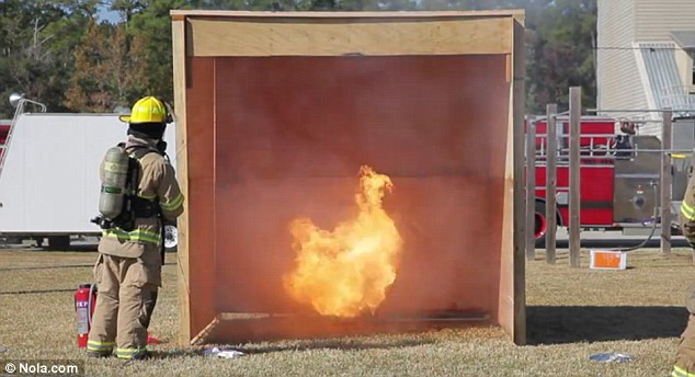 Spraying water onto a pot of boiling oil, firefighters showed how fast a turkey in a pot sitting atop a propane burner can become an inferno
