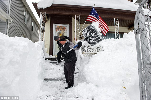 Shoveling: Shovel Brigade Mob volunteers Brett Lawton (front) and Chris Golino (back) remove snow