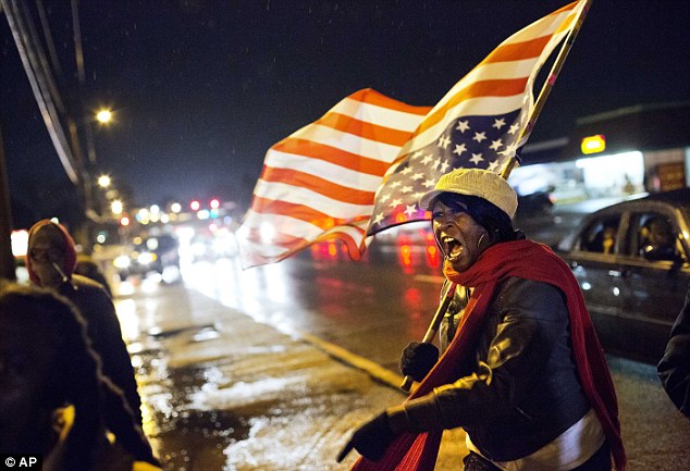 'Racism': Protesters accuse the county police of creating a racial divide in the majority black suburb 