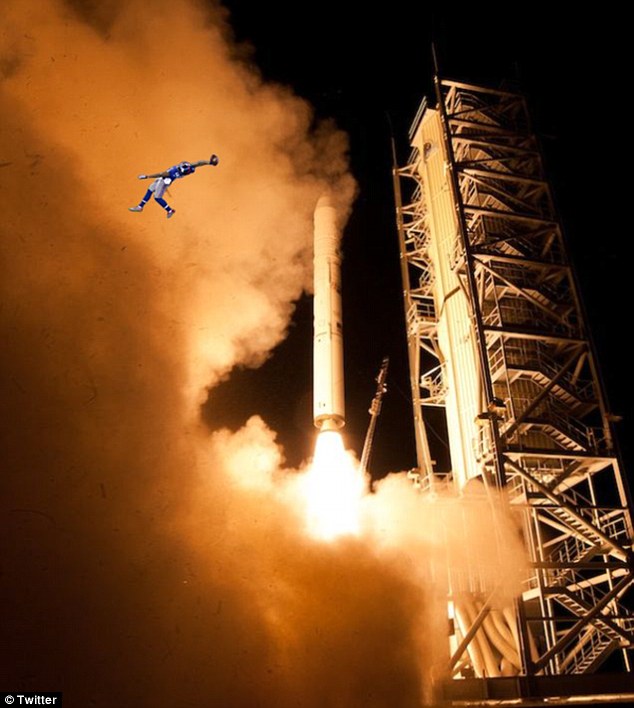 Blast-off: Beckham Jr may have launched himself high to make the catch last night... but not quite this high
