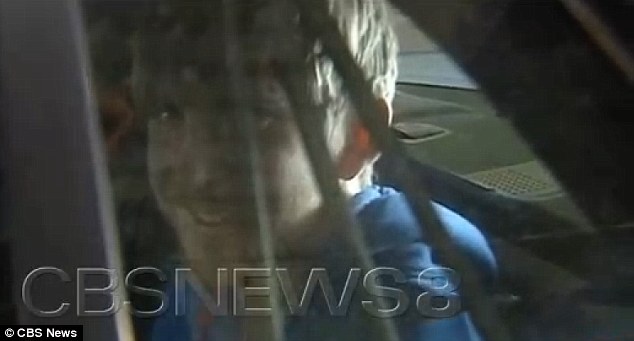 Caught: Peter smiled as he was taken into custody