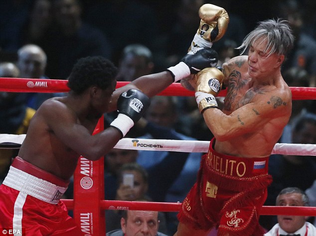 'Professional opponent': A source at Wild Card gym, where Seymour and Rourke (pictured facing off in Friday's fight) both train, said that Seymour was a 'professional opponent' who is 'paid to lose'