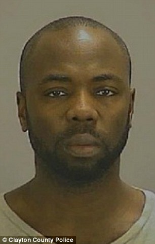 Captors: Father Gregory Jean, 37 (pictured), and stepmother Samantha Joy Davis, 42, are expected to appear in court Sunday morning on charges of false imprisonment, obstruction and cruelty to a child. Three other minors were also arrested at the house where the unnamed boy was found