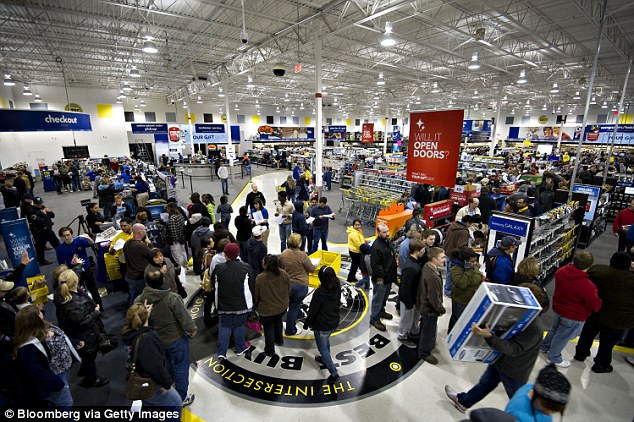 Shoppers walk through a Best Buy Co. store in Peoria, Illinois ahead of Black Friday sales across the nation 