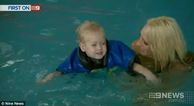 Clad in a $600 'dry' wetsuit specially designed for him, Jaylen had his first taste of the pool when he fearlessly plunged into the water with the aid of his mum