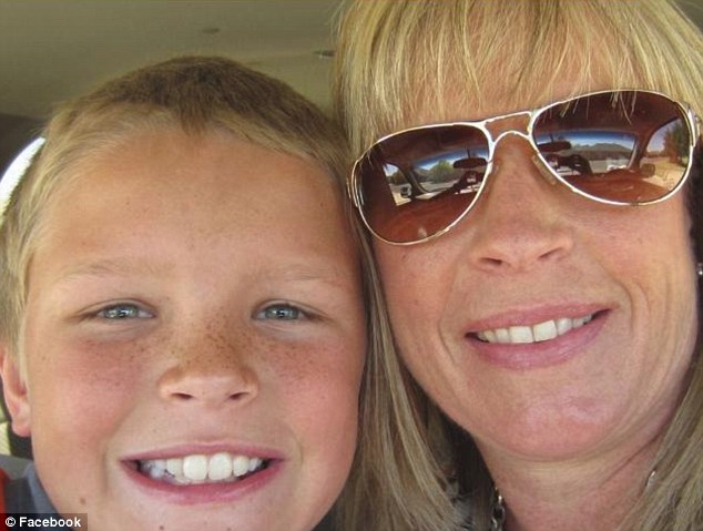 Beloved: After he was shot, Jackson (pictured with his mother) managed to stumble over to his father, who was outside the cabin at the time, before being rushed to Childress Regional Medical Center, where he died