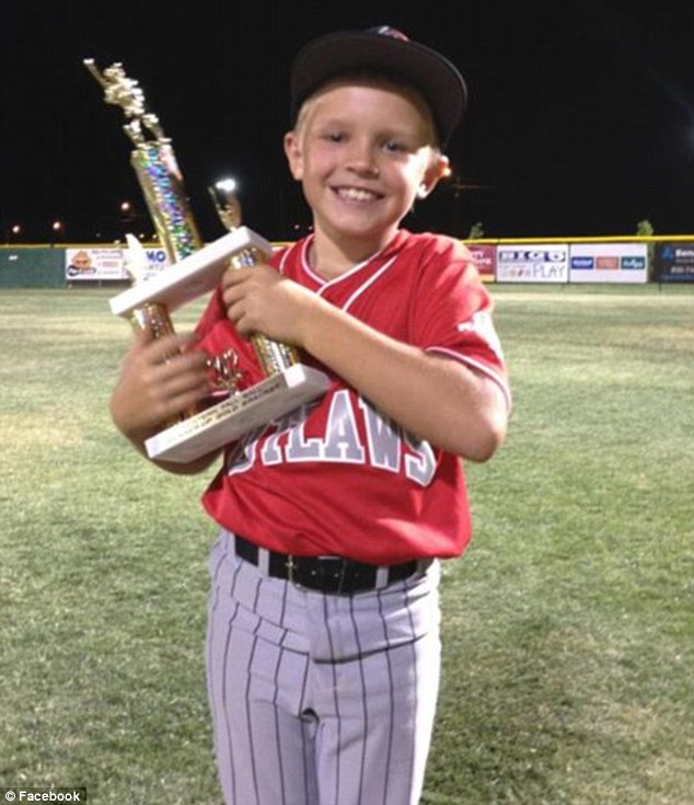 Tragic: Jackson Roberts (pictured), a fourth grader and talented baseball player, was sitting in a cabin in Lubbock on Friday night when his brother, 14, pointed a gun at him and accidentally shot him in the chest