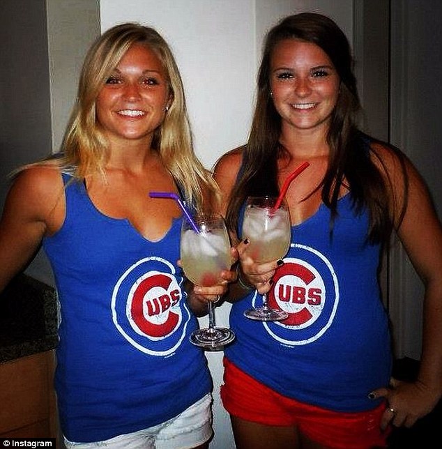 Friends: Baures was a Chicago Cubs fan and poses here with a friend and fellow supporter with a drink in hand