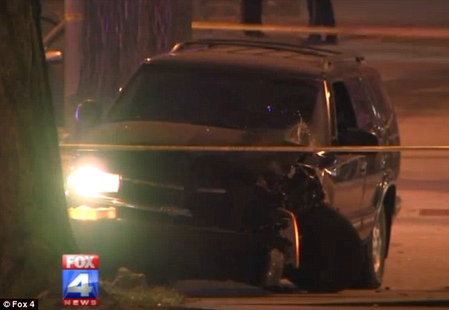 SUV: In an email, Kansas City police spokesman, Darin Snapp, told The Associated Press that the suspect's black SUV (pictured after the crash) had been seen cruising around the area by patrol officers late October