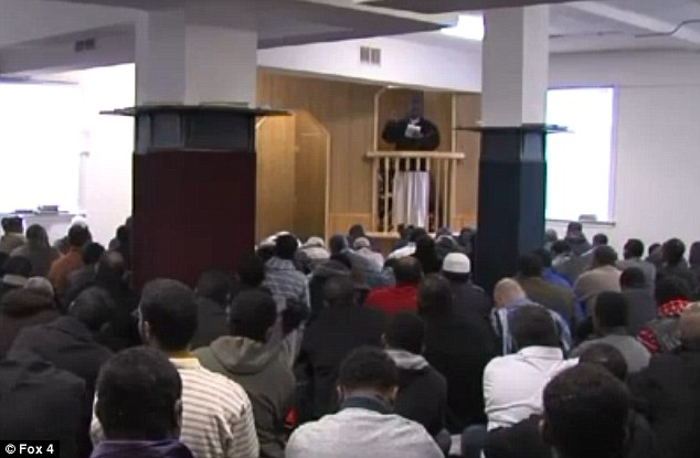 Grief-stricken: On Friday, dozens of the victim's grief-stricken friends and family members gathered for a prayer service (pictured), where Abdisamad was remembered for being a kind and faithful young Muslim