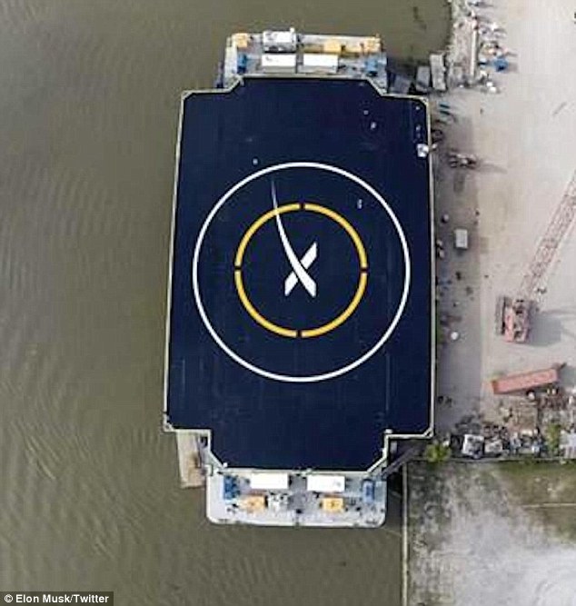 The barge (shown) measures about 300 feet (90 metres) long by 100 feet (30 metres) wide, and also has wings that extend out to another 170 feet (50 metres)